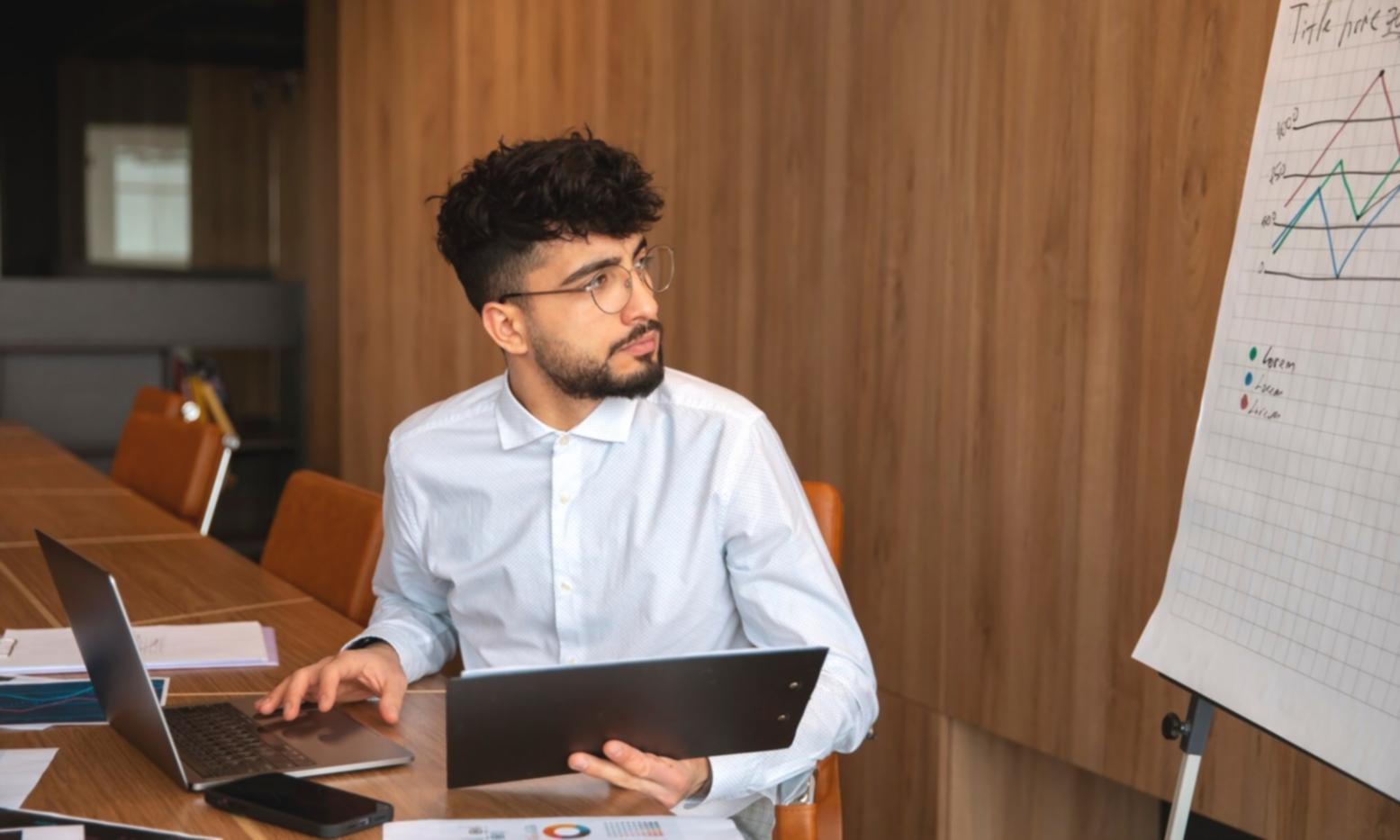 Professional woman reviewing financial charts and analysis documents